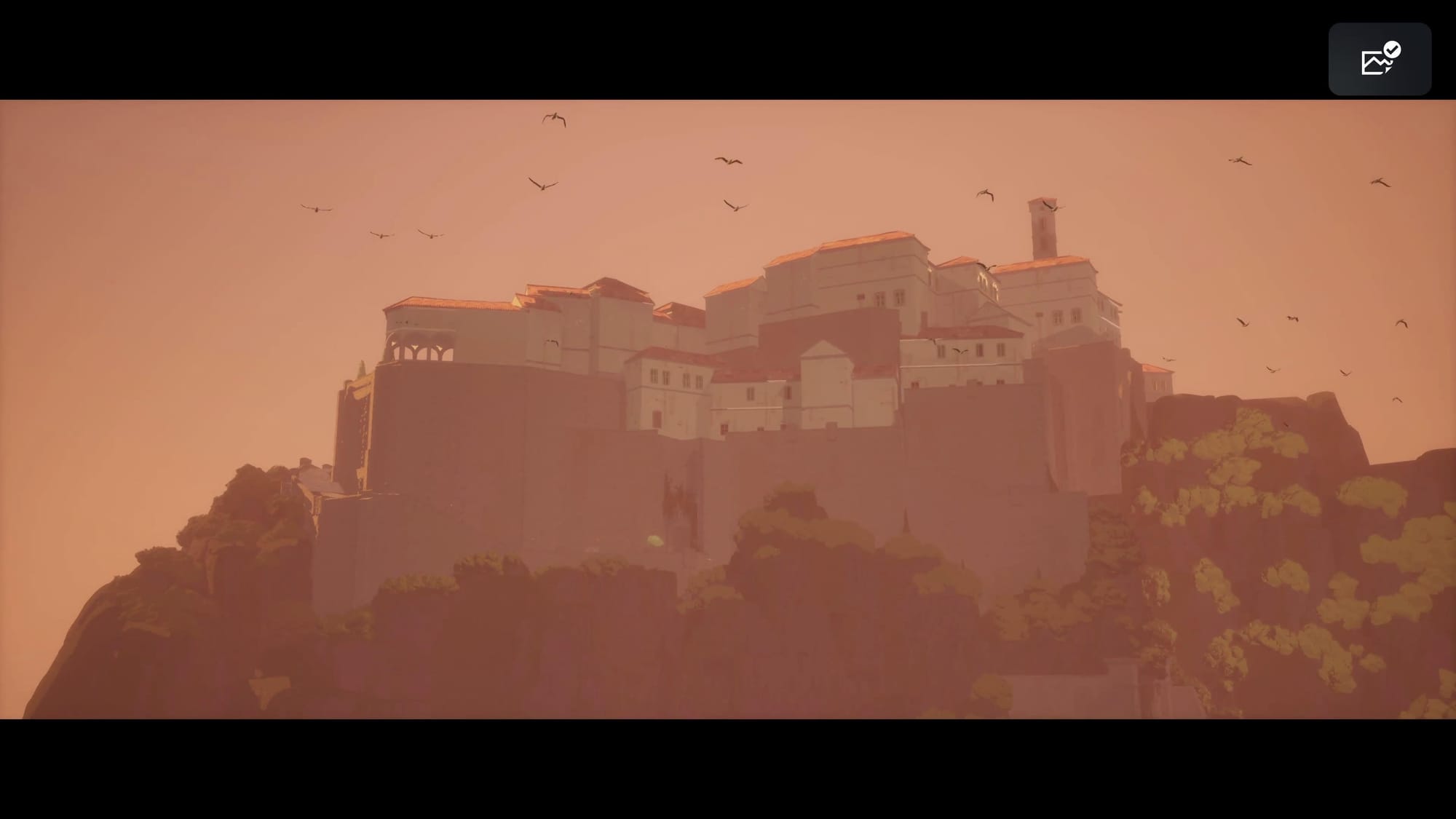 A screenshot showing a stone city on a high hill with high walls and birds flying around.
